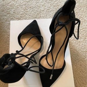 Black heels with lace around detail
